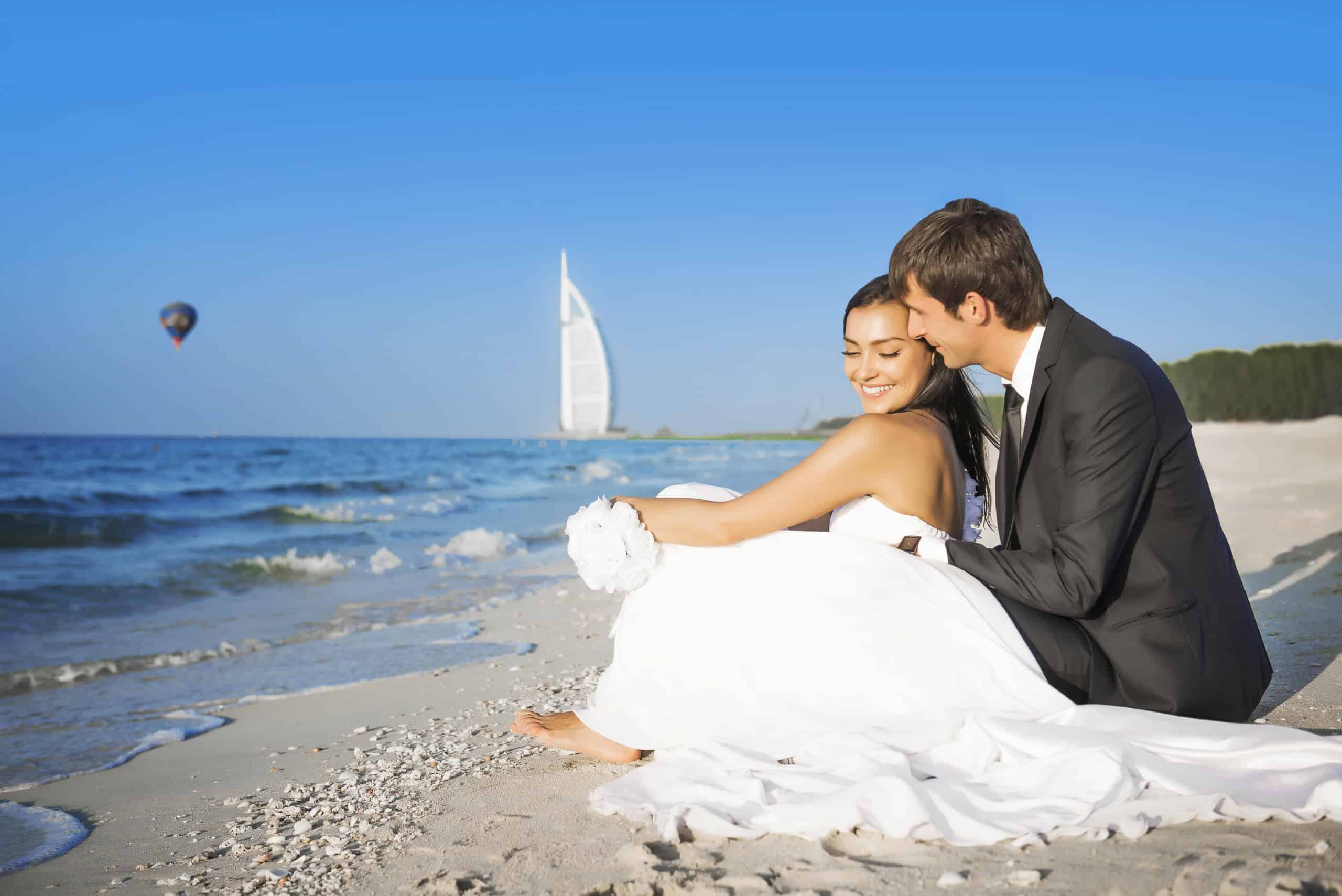 Bride and groom on beach in Dubai. Concept for Dubai Wedding Security